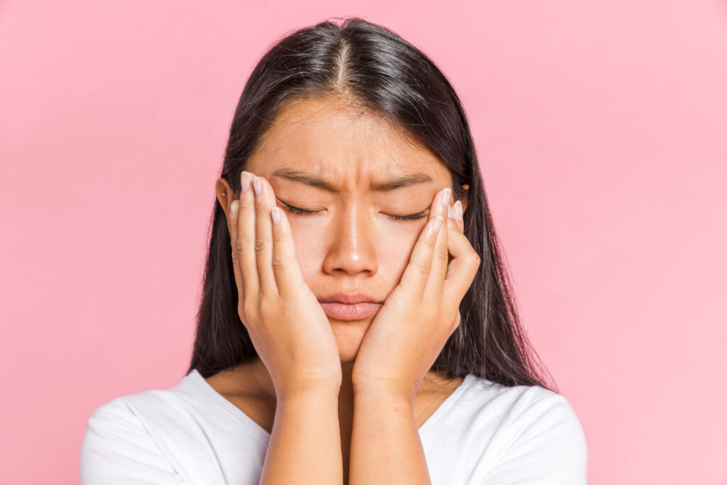 woman putting palms on her face